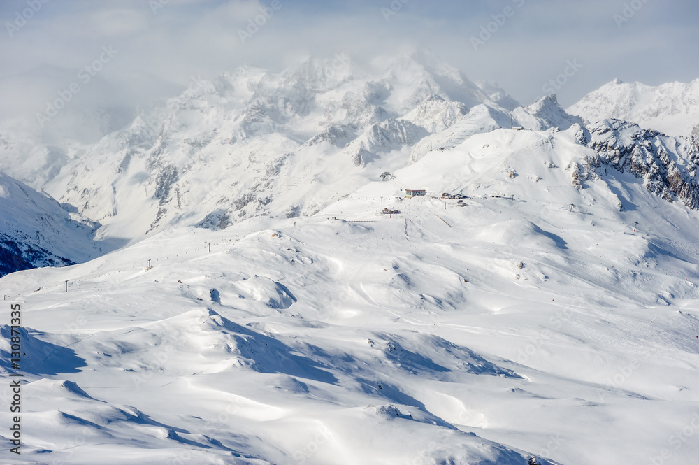 Alpine winter mountain landscape. French Alps with snow.