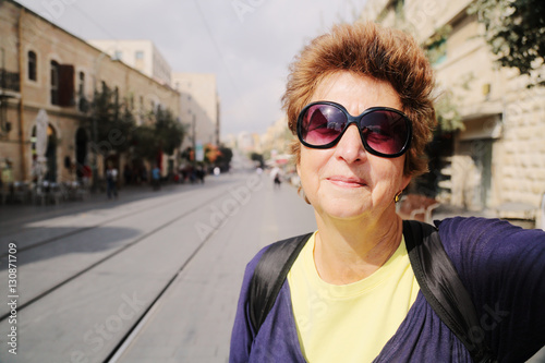 Portrait of cheerful senior woman enjoying the trip © dubova