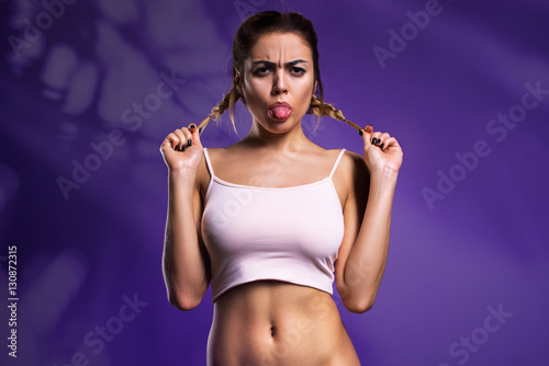 Sexy Woman Posing In White Shirt Isolated On The Violet Background