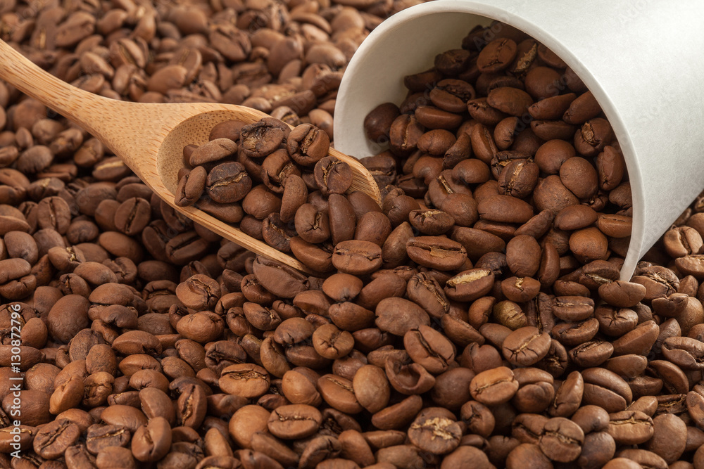 Coffee beans in a paper cup