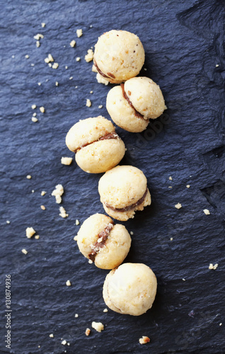 Baci di dama over black stone
