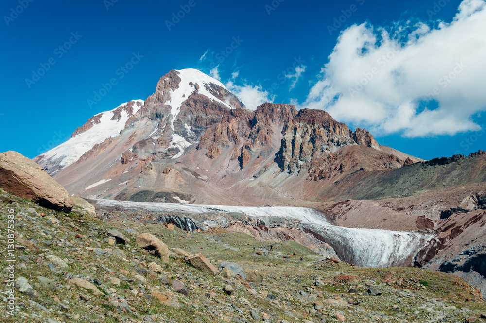 Mount Kazbek and dirty Gergeti glacier near Stepantsminda, Georgia