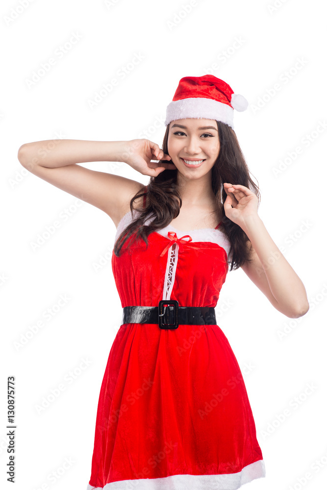 Christmas Woman. Beauty Asian Model Girl in Santa Hat isolated o Christmas Woman. Beauty Asian Model Girl in Santa Hat isolated o