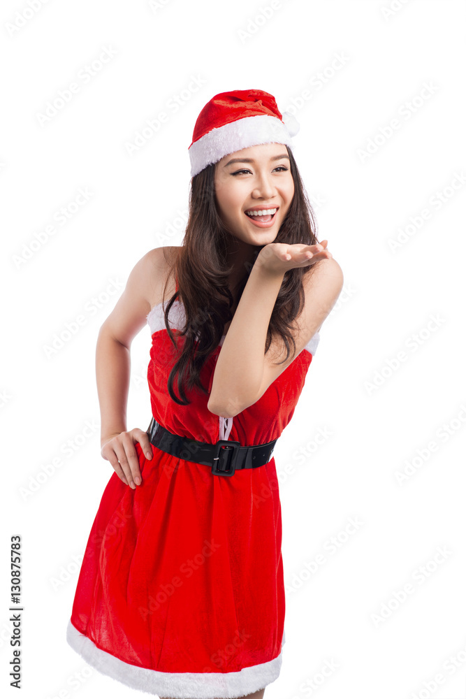 Christmas Woman. Beauty Asian Model Girl in Santa Hat isolated o Christmas Woman. Beauty Asian Model Girl in Santa Hat isolated o