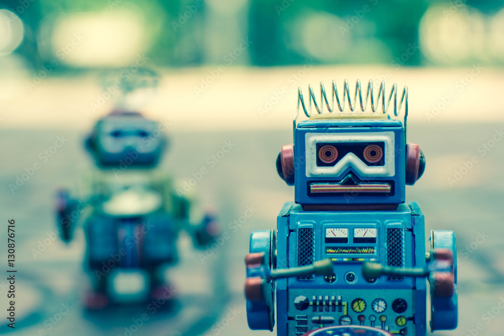 Fototapeta premium Old robot toy, vintage color style, vintage tone background.