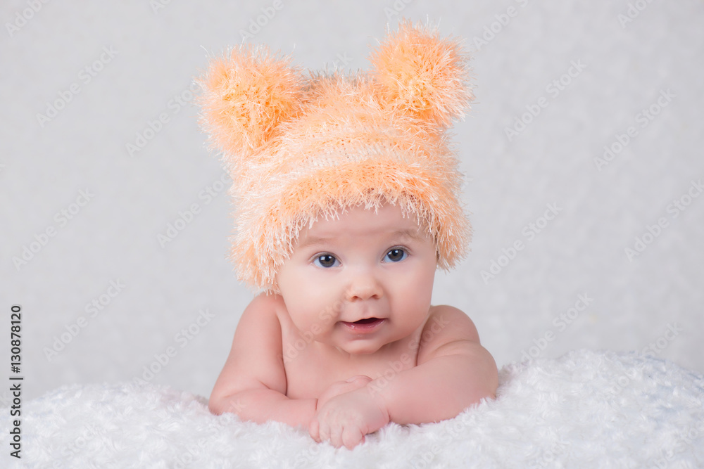 Newborn baby in a knitted cap with ears. Newborn baby in a knitted cap with ears.