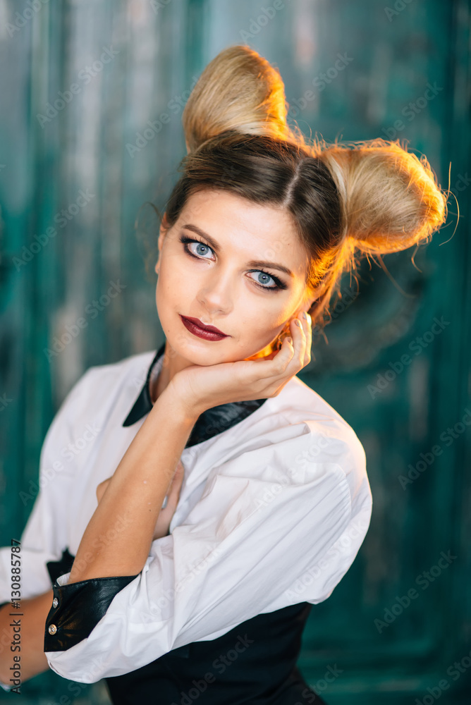 Obraz premium Stylish young woman in black pants, white shirt. portrait of a business lady.