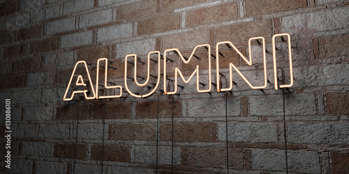 ALUMNI - Glowing Neon Sign on stonework wall - 3D rendered royalty free stock illustration.  Can be used for online banner ads and direct mailers.. photo
