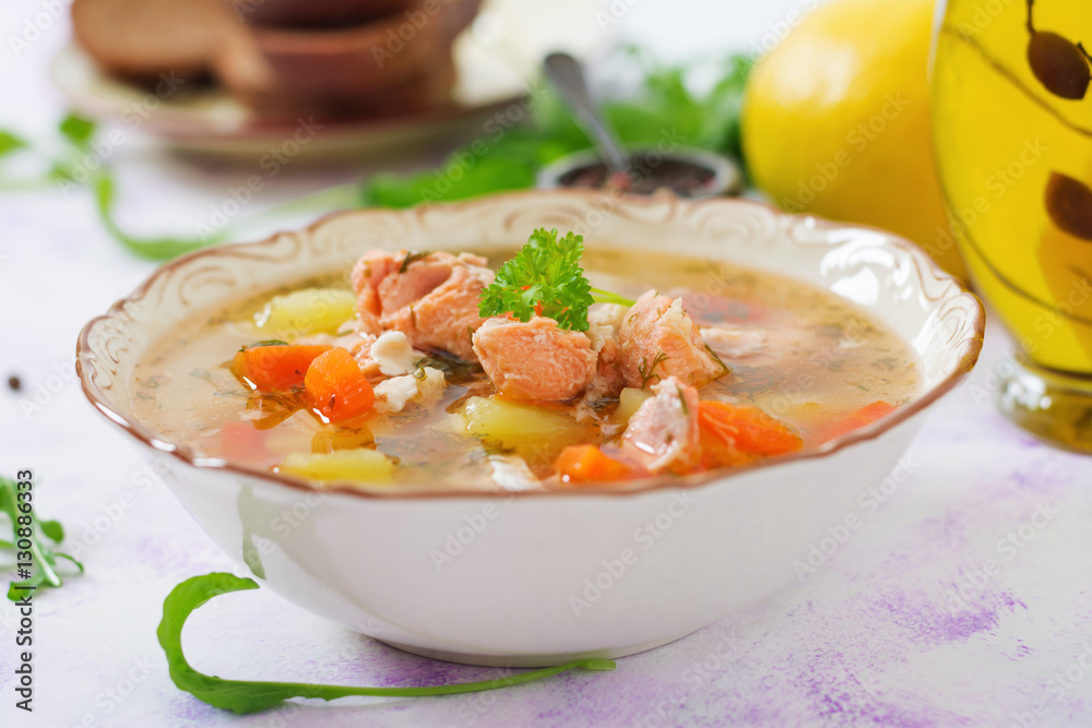 Salmon soup with vegetables in bowl Salmon soup with vegetables in bowl