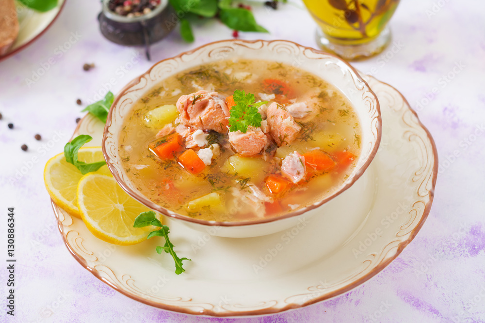 Salmon soup with vegetables in bowl Salmon soup with vegetables in bowl