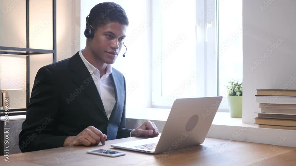 Black Businessman Attending Customer Call, Call Center Black Businessman Attending Customer Call, Call Center