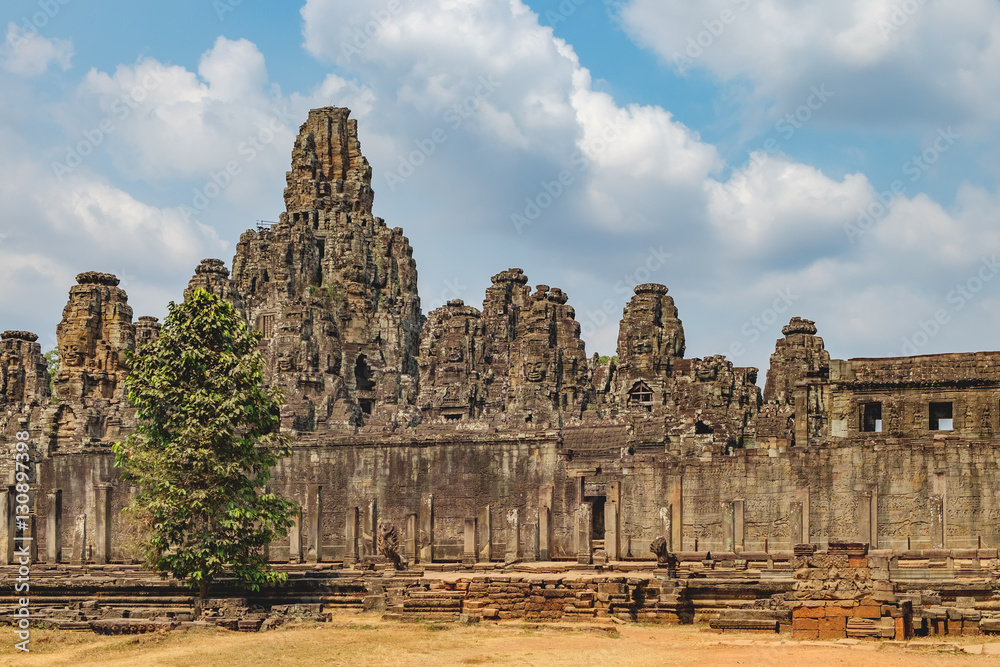 Prasat Bayon with smiling stone faces is the central temple of Angkor Thom Complex, Siem Reap, Cambodia. Ancient Khmer architecture and famous Cambodian landmark, World Heritage.