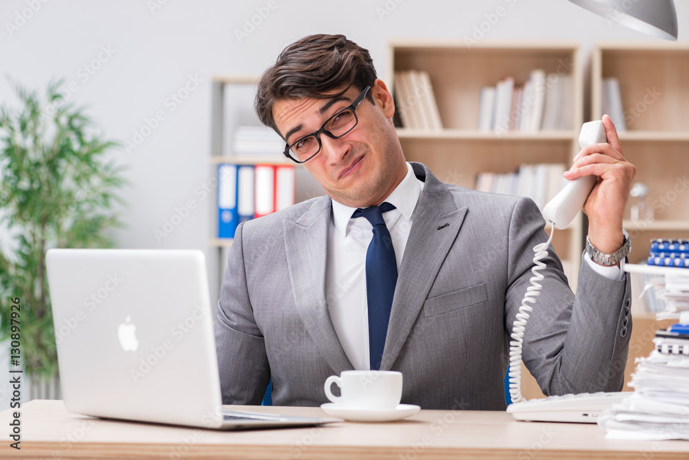Handsome businessman working in the office Handsome businessman working in the office