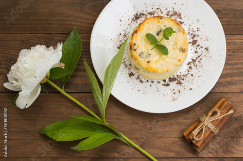 Curd pudding with raisins. Wooden rustic table. Close-up. Top view