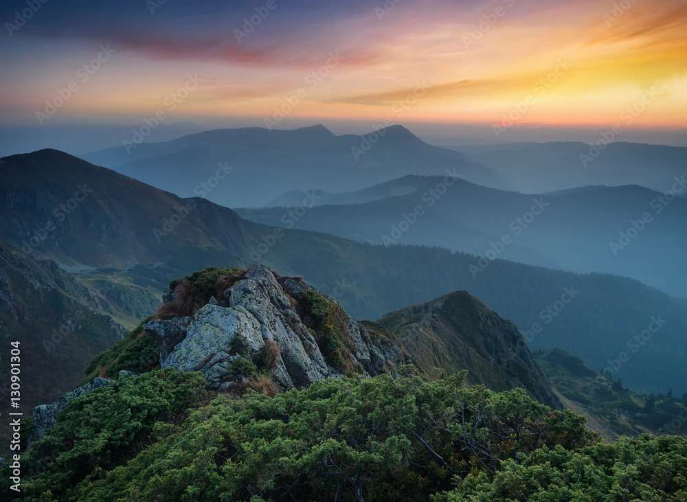 Obraz premium Mountains during sunset. Beautiful natural landscape in the summer time..