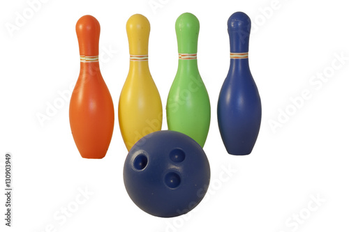 Children's set to play bowling. Ball and colored pins.
