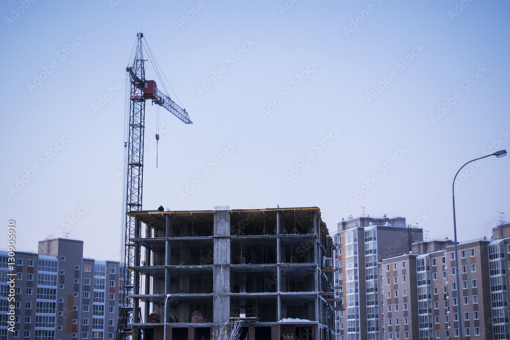 The construction of high-rise residential building and a crane