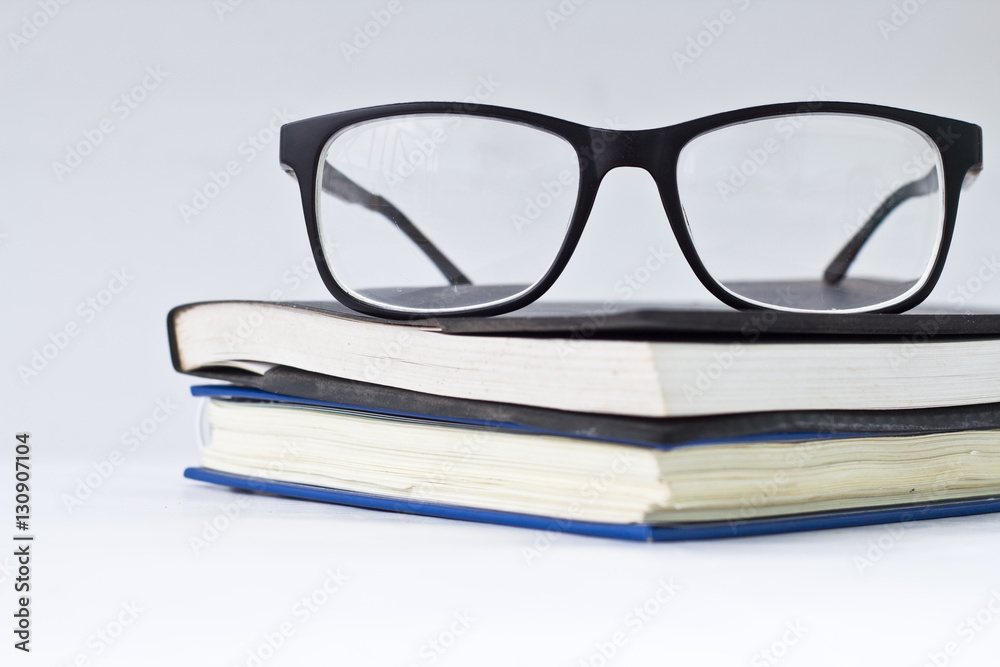 glasses and book isolated on white background. glasses and book isolated on white background.