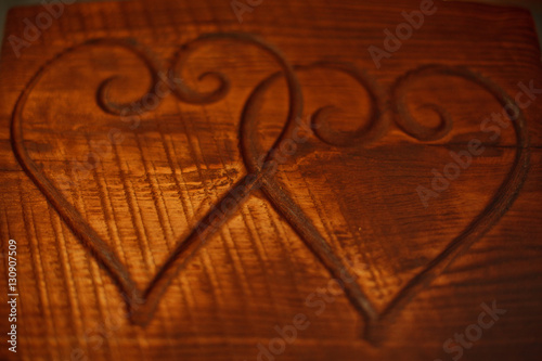 Two hearts on a wooden table