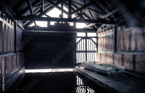 Boat in abandoned boathouse © ex_flow