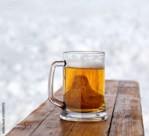 Glass mug with fresh cold beer