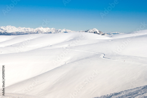 Cross country skier in a snowy mountain panorama