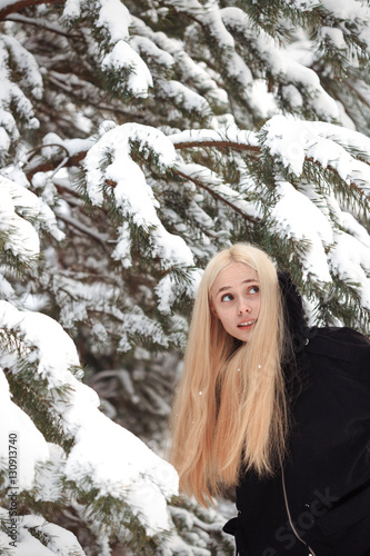 girl in a snowy winter forest. slum