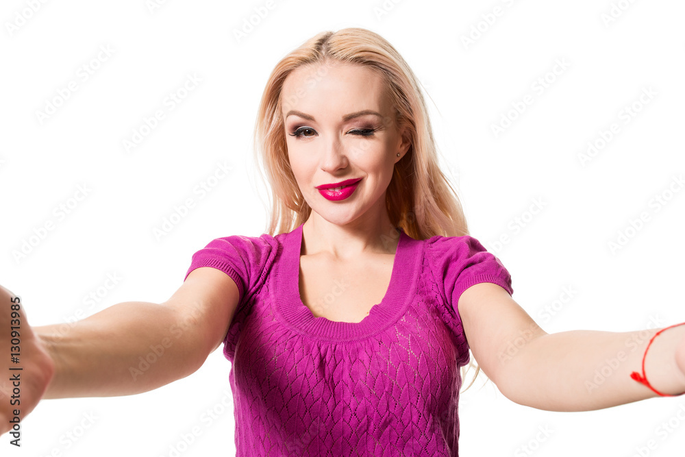 Blonde doing selfie on isolated white background. Taking picture. Blonde doing selfie on isolated white background. Taking picture.