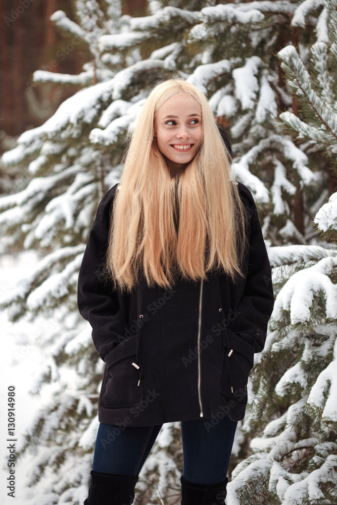 girl in a snowy winter forest. slum