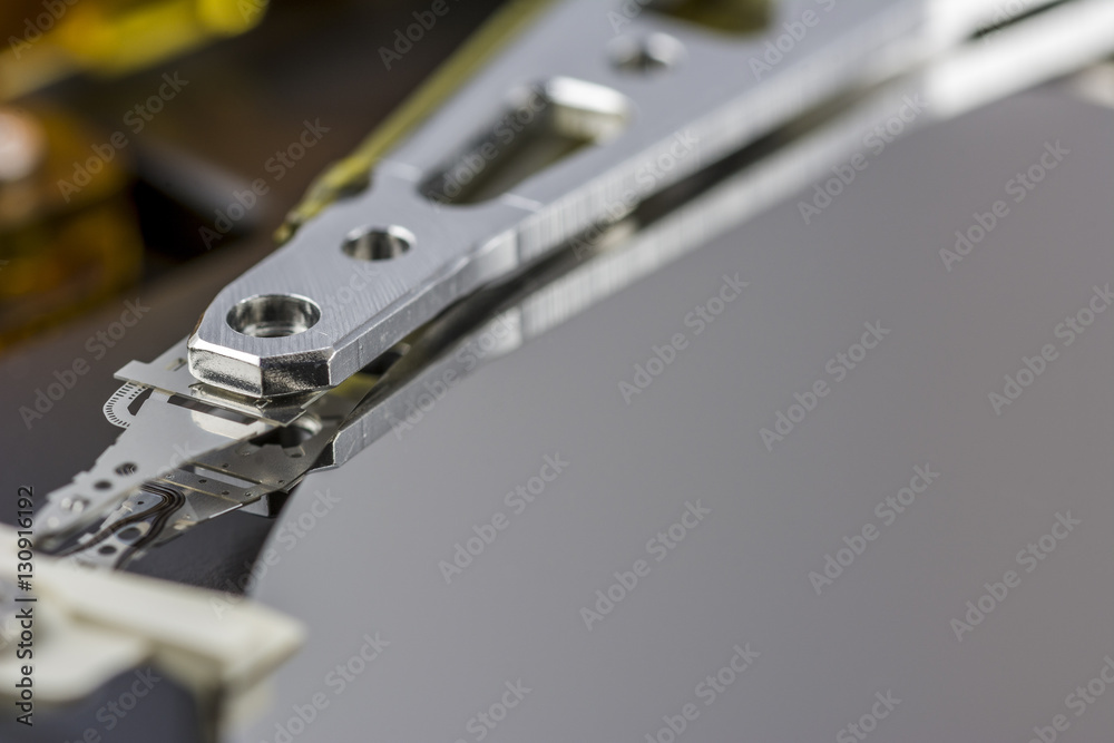 Close up photograph inside a computer hard drive Close up photograph inside a computer hard drive