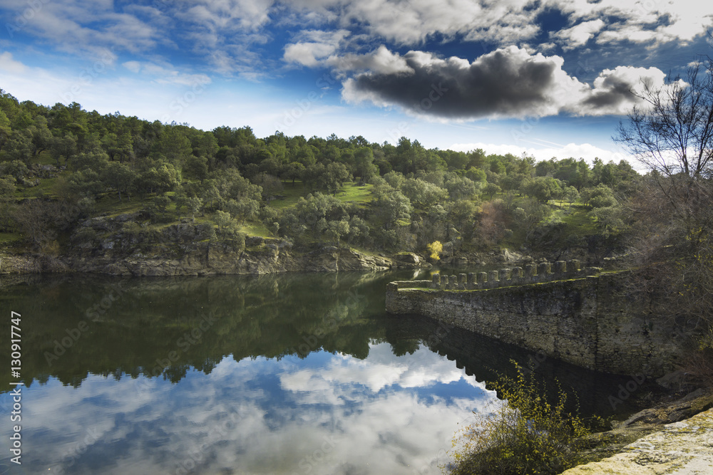 Riverbank and partial fortress wall of Bruitrago de Lozoya, Spain, Madrid. Riverbank and partial fortress wall of Bruitrago de Lozoya, Spain, Madrid.