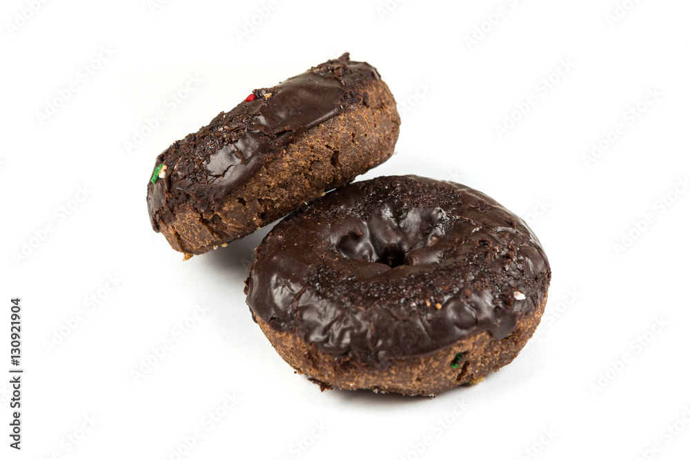 Chocolate frosted cake donuts isolated on a white background Chocolate frosted cake donuts isolated on a white background