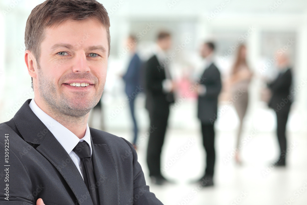 Happy mature business man looking at camera with satisfaction at office Happy mature business man looking at camera with satisfaction at office