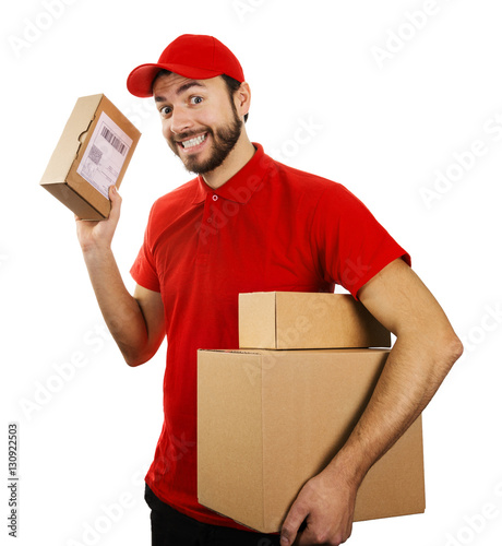 Obraz na plátně funny delivery service man with boxes isolated on white backgrou
