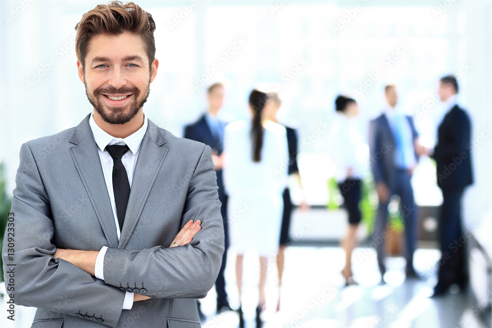 Happy mature business man looking at camera with satisfaction at office Happy mature business man looking at camera with satisfaction at office