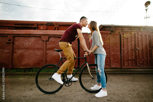 Love story. Young happy man on bike kissing own girlfriend.  Couple in love.  © Maksym Azovtsev