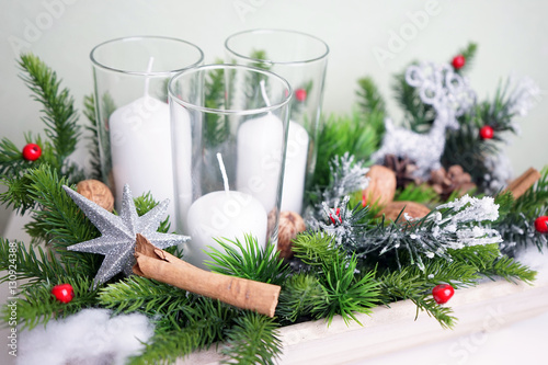 Christmas composition with white candle and deer