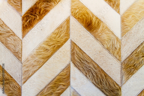 Obraz na plátně Close-up of an Argentinean handicraft sewn with cowhide with hai