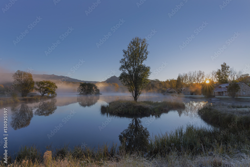 Fototapeta premium Mist on the water at sunrise