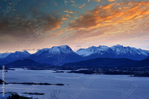 Winter Norwegian Landscape with Ocean and mountains during sunrise © Savvapanf Photo ©