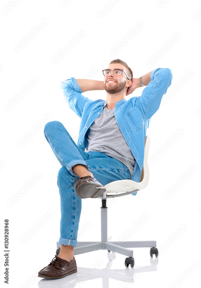 Young man sitting on the chair isolated over white background