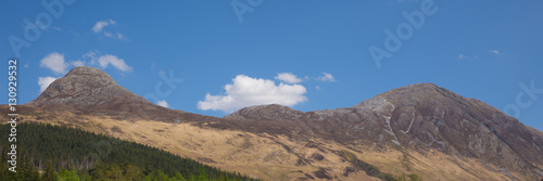 Panoramic view to mountains surrounding Glencoe Village Glen Coe Scotland UK 