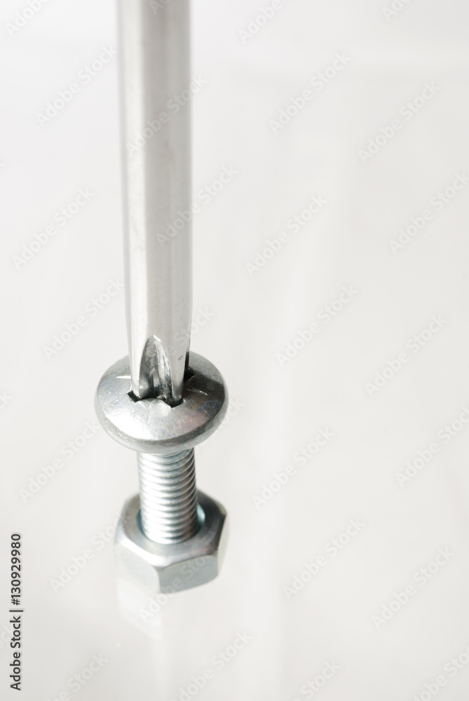 Nut and screw with a metal tool