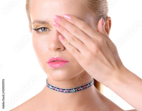 Young woman with choker on ...