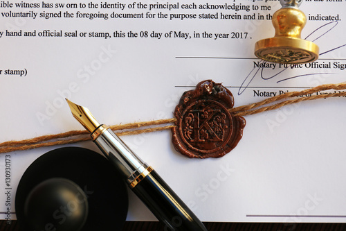 Old notarial wax seal and stamp on document, closeup