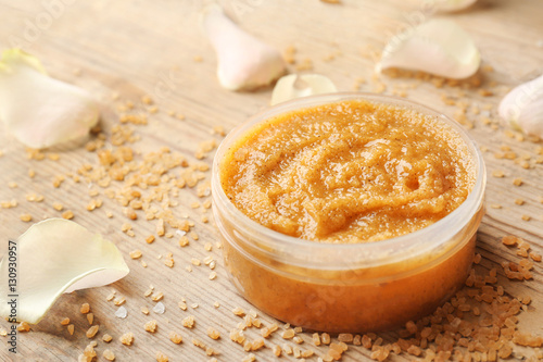 Tablou pe pânză Body scrub, petals and sugar on wooden background