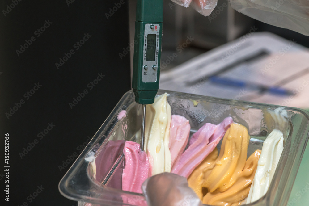 Digital food thermometer on ice cream
