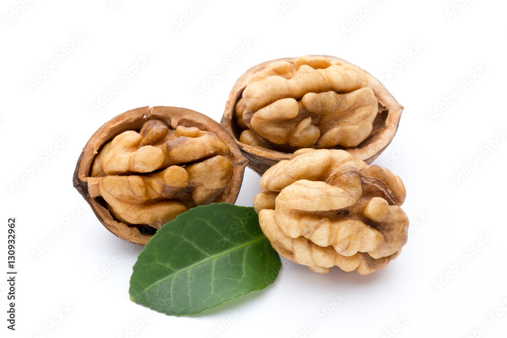 Walnut and walnut kernel isolated on the white background. Walnut and walnut kernel isolated on the white background.