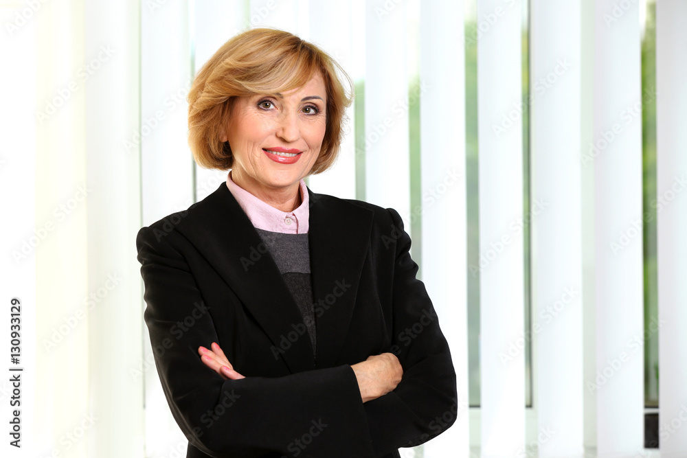 Portrait of senior successful businesswoman on light background Portrait of senior successful businesswoman on light background