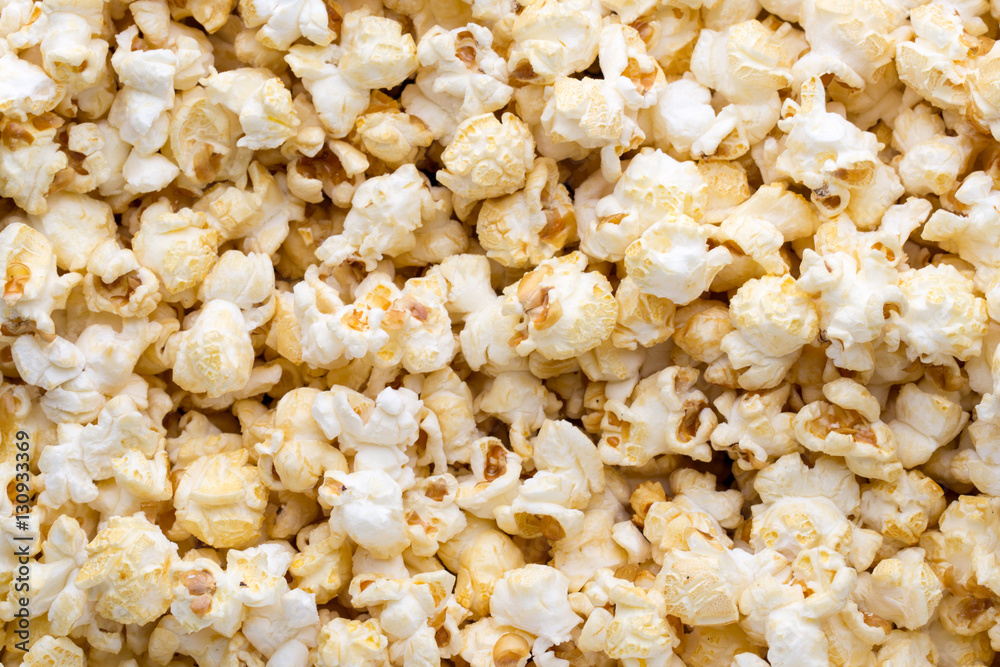 Popcorn background. Caramel sweet corn. Cinema snack.